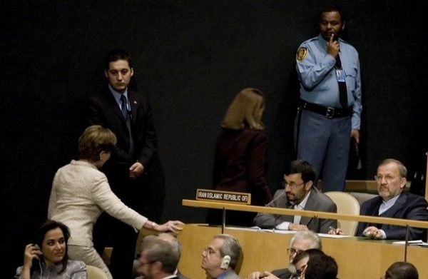 US First Lady Laura Bush (L) walks past Iranian President Mahmoud Ahmadinejad  as she takes her seat for US President George W. Bush's address to the United Nations General Assembly in New York, New York, 25 September 2007.  AFP PHOTO/Jim WATSON (Photo credit should read JIM WATSON/AFP/Getty Images)