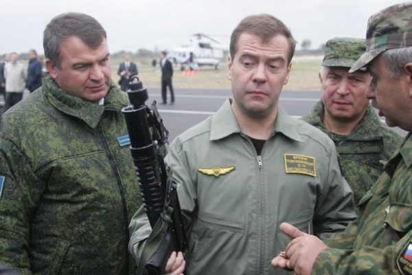 KALININGRAD, RUSSIA - SEPTEMBER 28: Russian Defence Minister Anatoly Serdyukov (L) and Chief of the General Staff of the Armed Forces Nikolai Makarov (2R) look on as President Dmitry Medvedev (C) hold a machine gun while inspecting weapons and military equipment at the Baltic Fleet's Khmelyovka training center near Baltiysk on September 28, 2009 in the Kaliningrad Region, Russia. Dmitry Medvedev arrived in the Kaliningrad Region to attend Zapad-2009 (West-2009) military exercises. The exercises are being conducted with a combined force of Russian and Belarusian troops. (Photo by )