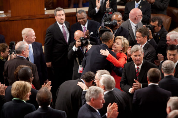 President Barack Obama hugs Secretary of State Hillary Rodham Clinton as he enters the House Chamber at the U.S. Capitol in Washington, D.C., Sept. 9, 2009. (Official White House Photo by Lawrence Jackson) This official White House photograph is being made available only for publication by news organizations and/or for personal use printing by the subject(s) of the photograph. The photograph may not be manipulated in any way and may not be used in commercial or political materials, advertisements, emails, products, or promotions that in any way suggests approval or endorsement of the President, the First Family, or the White House.