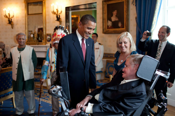 President Barack Obama talks with Stephen Hawking in the Blue Room of the White House before a ceremony presenting him and 15 others the Presidential Medal of Freedom, August 12, 2009. The Medal of Freedom is the nation's highest civilian honor.  (Official White House photo by Pete Souza)  This official White House photograph is being made available only for publication by news organizations and/or for personal use printing by the subject(s) of the photograph. The photograph may not be manipulated in any way and may not be used in commercial or political materials, advertisements, emails, products, promotions that in any way suggests approval or endorsement of the President, the First Family, or the White House.