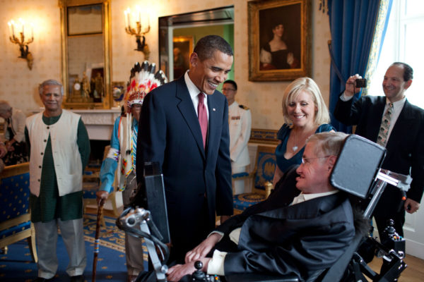 President Barack Obama talks with Stephen Hawking in the Blue Room of the White House before a ceremony presenting him and 15 others the Presidential Medal of Freedom, August 12, 2009. The Medal of Freedom is the nation's highest civilian honor. (Official White House photo by Pete Souza) This official White House photograph is being made available only for publication by news organizations and/or for personal use printing by the subject(s) of the photograph. The photograph may not be manipulated in any way and may not be used in commercial or political materials, advertisements, emails, products, promotions that in any way suggests approval or endorsement of the President, the First Family, or the White House.