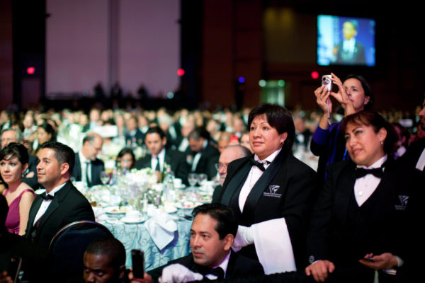 Waiters in the audience listen to President Barack Obama's speech at the Congressional Hispanic Caucus Institute's 32nd Annual Awards Gala dinner in Washington, D.C. on Sept. 16, 2009