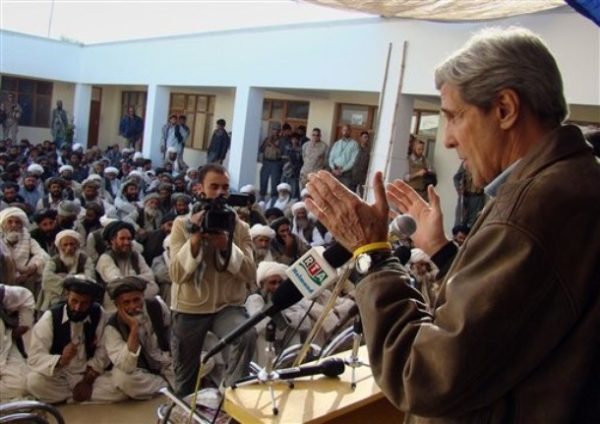 In this photo taken Sunday, Oct. 18, 2009, U.S. Sen. John Kerry, D-Mass, right, speaks to elders of Garmser district in Helmand province, southern Afghanistan. (AP Photo/Abdul Khaleq)