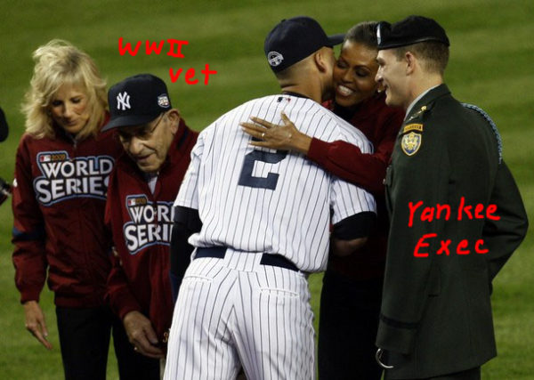 U.S. first lady Michelle Obama (2nd R) is kissed by New York Yankees Derek Jeter (3rd L) as they stand with New York Yankees Hall of Famer Yogi Berra (2nd L), U.S. vice president's wife Jill Biden (L), and Retired U.S. Army Captain Tony Odierno (R) during pre-game ceremonies before Game 1 of the 2009 Major League Baseball World Series in New York, October 28, 2009. REUTERS/Shannon Stapleton (UNITED STATES SPORT BASEBALL)