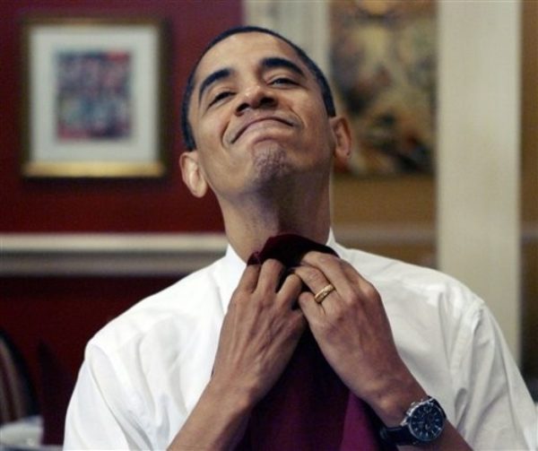 FILE- In this Feb. 7, 2008, file photo then  Democratic presidential hopeful Sen. Barack Obama, D-Ill., smiles as he puts on a napkin before eating gumbo at Dooky Chase's restaurant in New Orleans.  Pizza in St. Louis, pancakes in Pittsburgh. A burger with spicy mustard or a chili half-smoke in D.C., soul food in Chicago. Call it the mouth that roared: Our president eats something and the world wants to eat it, too.  (AP Photo/Rick Bowmer, File)