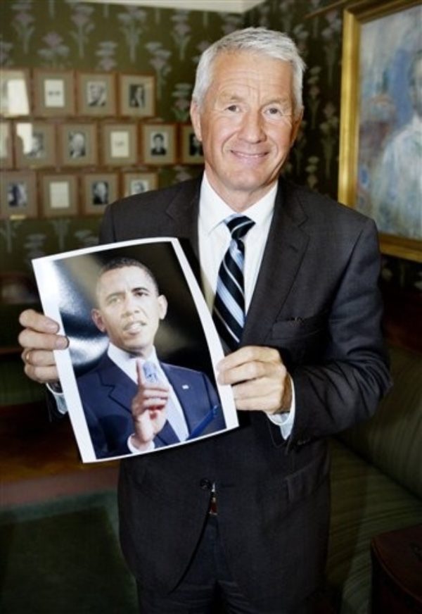 Chairman of the Norwegian Nobel Committee, Thorbjoern Jagland, holds a picture of US President Barack Obama, in Oslo, Norway, Friday, Oct. 9, 2009, after the announcement of Obama as winner of the 2009 Nobel Peace Prize. The citation for the award, in part says, The Norwegian Nobel Committee has decided that the Nobel Peace Prize for 2009 is to be awarded to President Barack Obama for his extraordinary efforts to strengthen international diplomacy and cooperation between peoples. The Committee has attached special importance to Obama's vision of and work for a world without nuclear weapons. (AP Photo / Jon-Michael Josefsen, Scanpix) ** NORWAY OUT **