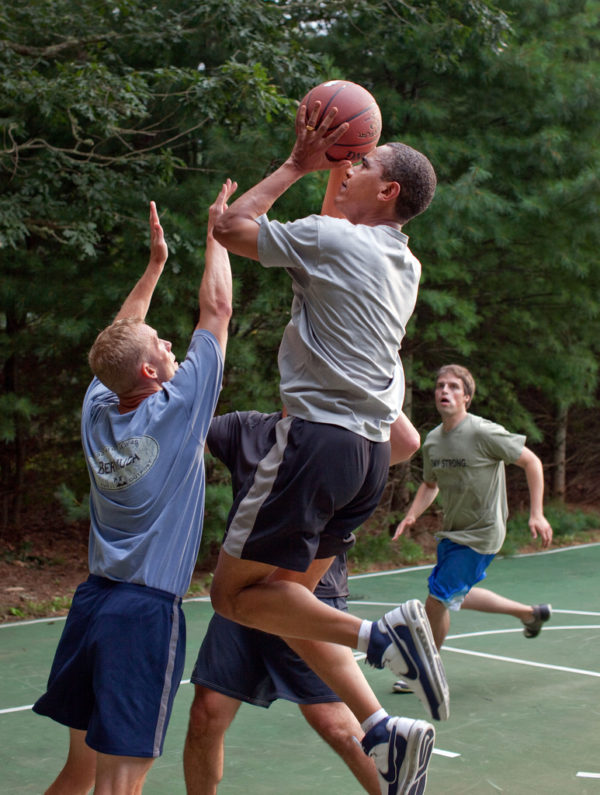 President Barack Obama plays basketball with White House staffers while on vacation on Martha's Vineyard, Aug. 26, 2009.  (Official White House Photo by Pete Souza)  This official White House photograph is being made available only for publication by news organizations and/or for personal use printing by the subject(s) of the photograph. The photograph may not be manipulated in any way and may not be used in commercial or political materials, advertisements, emails, products, or promotions that in any way suggests approval or endorsement of the President, the First Family, or the White House.