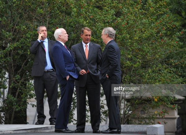 House Minority Leader John Boehner (C), R-OH, chats with Senate Armed Services Committee Ranking Member John McCain (L), R-AZ, and Senate Minority Leader Mitch McConnell, R-KY, near the West Wing after a meeting on Afghanistan and Pakistan with US President Barack Obama October 6, 2009 at the White House in Washington, DC. Obama Tuesday sat down with senior lawmakers driving a raging debate on US Afghan strategy, as he works towards a decision on whether to send thousands more troops to war. Democratic and Republican leaders plus top members of key congressional committees met the president at the White House touting sharply conflicting visions of the next steps in the unpopular eight-year US military operation. Obama is methodically working through an internal policy review after US commander General Stanley McChrystal warned the war could be lost within a year without more troops, and reportedly asked for 40,000 more men. AFP PHOTO/Mandel NGAN (Photo credit should read MANDEL NGAN/AFP via Getty Images)