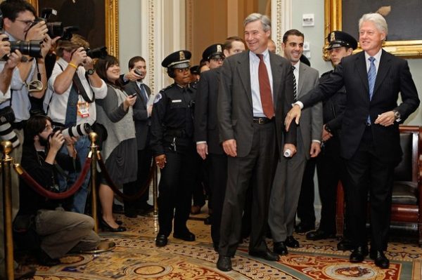 WASHINGTON - NOVEMBER 10: Former U.S. President Bill Clinton (R) is accompanied by Sen. Sheldon Whitehouse (D-RI) (C) as he heads into the Senate Democratic Caucus luncheon at the U.S. Capitol November 10, 2009 in Washington, DC. Clinton was on the Hill to talk to lawmakers about passing health care reform legislation through the Senate. (Photo by Chip Somodevilla/Getty Images)