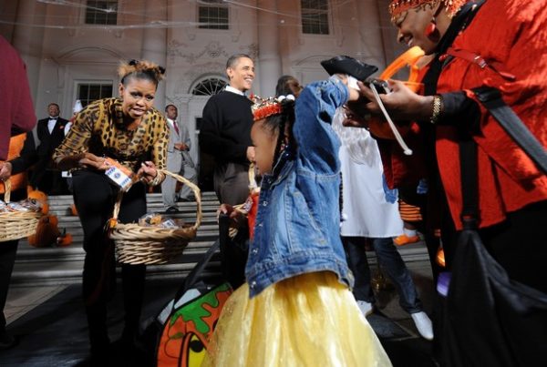 US President Barack Obama and First Lady Michelle Obama greet trick or treaters at the North Portico of the White House as they celebrate Halloween in Washington, DC, on October 31, 2009. The First couple welcomed more than 2,000 children from Washington, Maryland and Virginia schools and their families to celebrate Halloween. AFP PHOTO/Jewel SAMAD (Photo credit should read JEWEL SAMAD/AFP/Getty Images)