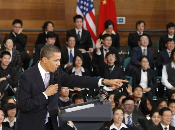 U.S. President Barack Obama gestures during a town hall meeting with future Chinese leaders at the Museum of Science and Technology in Shanghai November 16, 2009. Obama faces tensions with China over trade and Tibet on his first visit to the emerging superpower for a summit that will grapple with economic imbalances and the future of the yuan. REUTERS/Jason Reed (CHINA POLITICS)