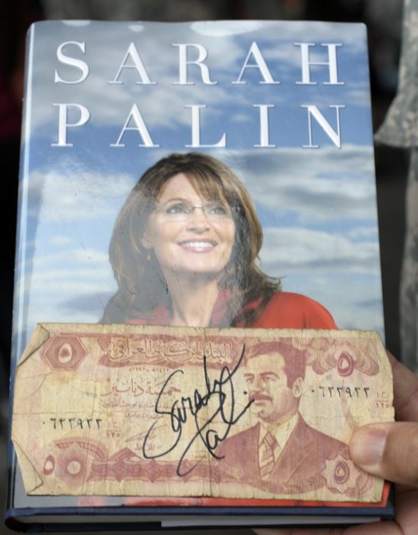 FORT BRAGG, NC - NOVEMBER 23: Former Alaska Gov. Sarah Palin's signature is seen on an Iraqi dinar note she signed for 82nd Airborne's Sgt. David Vogelslang during the signing of her memoir "Going Rogue" at the North Post Exchange on November 23, 2009 in Fort Bragg, North Carolina. Hundreds of people turned out for Palin's appearance. (Photo by Sara D. Davis/Getty Images)