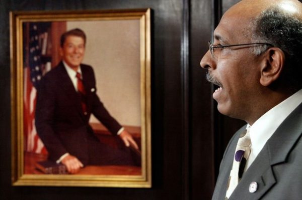 WASHINGTON - NOVEMBER 04:  With a photograph of former President Ronald Reagan hanging on the wall, Republican National Committee Chairman Michael Steele holds a news conference at the committee's headquarters on Captiol Hill November 4, 2009 in Washington, DC. "Republicans won from the courthouse to the statehouse," Steele said while talking about GOP wins in yesterday's elections in New Jersey, Virginia and other races across the country.  (Photo by Chip Somodevilla/Getty Images)