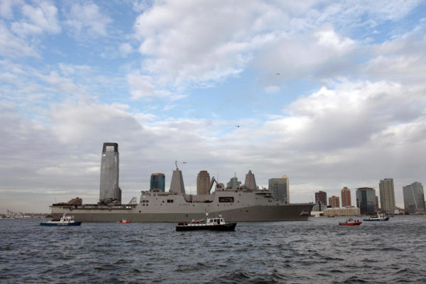 NEW YORK - NOVEMBER 02: The future USS New York passes lower Manhattan next to where the World Trade Center towers once stood November 2, 2009 in New York City. The ship, which is built with 7.5 tons of steel from the World Trade Center in her bow, is an amphibious transport dock ship and will be commissioned during a ceremony on November 7. As the ship entered New York Harbor where dozens of firefighters, family members of September 11 victims and onlookers gathered to watch a detail aboard the 684-foot vessel fire a 21-gun salute. (Photo by Spencer Platt/Getty Images)