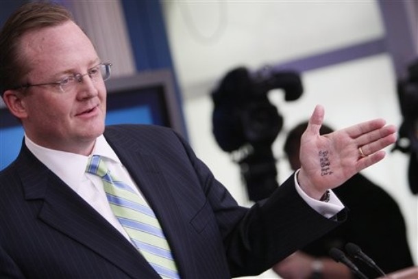 White House Press Secretary Robert Gibbs has the words "Eggs, Milk, Bread (crossed out), Hope, and Change" written in marker on his hand as he briefs reporters, after President Barack Obama made an unannounced visit to the James Brady Briefing Room at the White House in Washington, Tuesday, Feb. 9, 2010. Former Vice Presidential candidate Sarah Palin has been seen with hand written notes on her hands in recent public appearances. (AP Photo/Charles Dharapak)