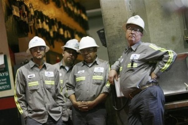 Southern Nevada Paving workers listens as Senate Majority Leader Harry Reid, D-Nev. touts his jobs bill, Thursday, Feb. 18, 2010 in Las Vegas. The GOP has targeted Sen. Reid for defeat in his re-election bid this year. (AP Photo/Isaac Brekken)