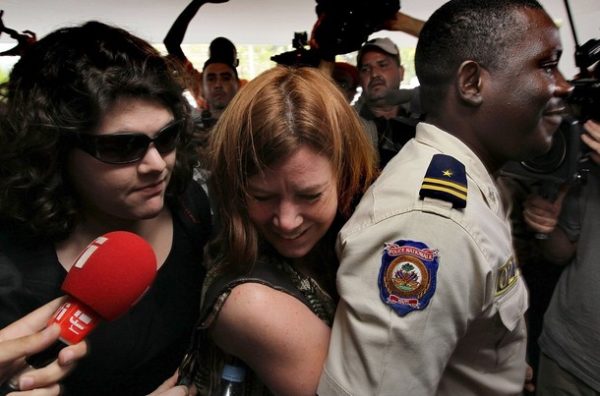 PORT-AU-PRINCE, HAITI - FEBRUARY 04: Laura Silsby, (C), the head of New Life Children's Refuge leaves a court hearing with another member of her group, Charisa Coulter February 4, 2010 after being accused of child abduction and criminal association in Port-au-Prince, Haiti. Five women and five men are part of a church organization that attempted to cross into the Dominican Republic with 33 Haitian children. (Photo by John Moore/Getty Images)