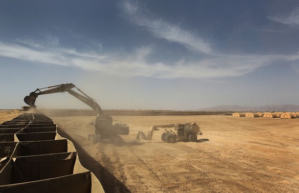 FORWARD OPERATING BASE RAMROD, AFGHANISTAN - MARCH 11:  U.S. Army soldiers from the 60th Engineer Company construct a perimeter wall while expanding an American military base for incoming troops on March 11, 2010 at Forward Operating Base Ramrod in Kandahar province, Afghanistan. Bases across southern Afghanistan are being enlarged to accommodate the surge of fresh troops ordered by President Obama as part of the new war strategy.  (Photo by John Moore/Getty Images)