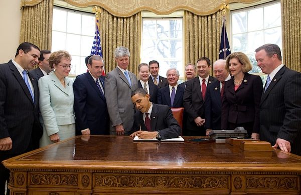 President Barack Obama signs an Executive Order that reaffirms the Patient Protection and Affordable Care Act's conssistency with longstanding restrictions on the use of federal funds for abortion, in the Oval Office, March 24, 2010. (Official White House Photo by Pete Souza) This official White House photograph is being made available only for publication by news organizations and/or for personal use printing by the subject(s) of the photograph. The photograph may not be manipulated in any way and may not be used in commercial or political materials, advertisements, emails, products, promotions that in any way suggests approval or endorsement of the President, the First Family, or the White House.