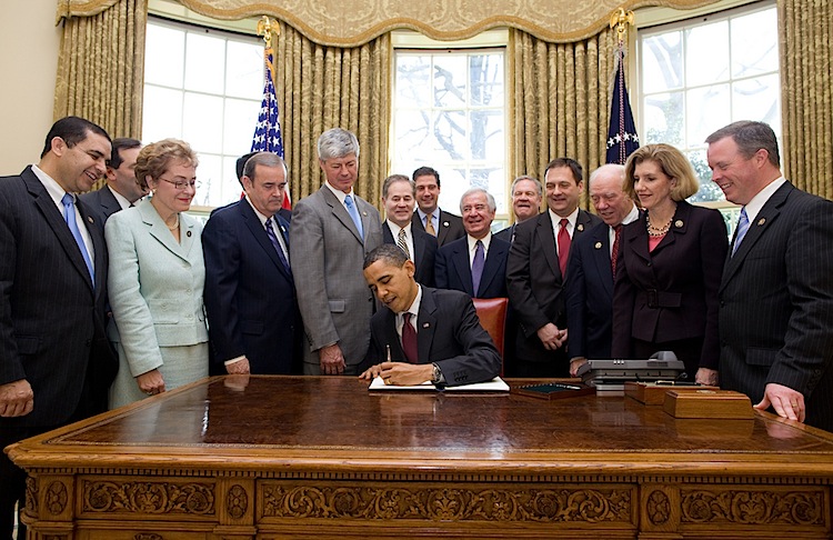 President Barack Obama signs an Executive Order that reaffirms the Patient Protection and Affordable Care Act's conssistency with longstanding restrictions on the use of federal funds for abortion, in the Oval Office, March 24, 2010. (Official White House Photo by Pete Souza)  This official White House photograph is being made available only for publication by news organizations and/or for personal use printing by the subject(s) of the photograph. The photograph may not be manipulated in any way and may not be used in commercial or political materials, advertisements, emails, products, promotions that in any way suggests approval or endorsement of the President, the First Family, or the White House.