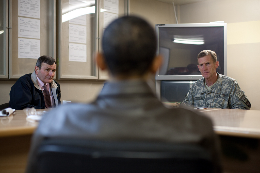 President Barack Obama meets with U.S. Ambassador Karl Eikenberry, left, and Gen. Stanley McChrystal at Bagram Air Field in Afghanistan, March 28, 2010. (Official White House Photo by Pete Souza)  This official White House photograph is being made available only for publication by news organizations and/or for personal use printing by the subject(s) of the photograph. The photograph may not be manipulated in any way and may not be used in commercial or political materials, advertisements, emails, products, promotions that in any way suggests approval or endorsement of the President, the First Family, or the White House.