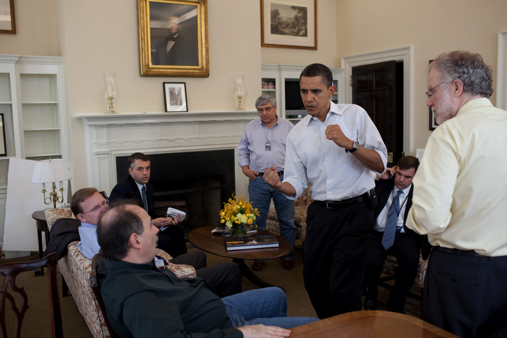 President Barack Obama pumps his fists during a meeting with senior staff in the Chief of Staff 's Office at the White House, March 21, 2010. (Official White House Photo by Pete Souza)  This official White House photograph is being made available only for publication by news organizations and/or for personal use printing by the subject(s) of the photograph. The photograph may not be manipulated in any way and may not be used in commercial or political materials, advertisements, emails, products, promotions that in any way suggests approval or endorsement of the President, the First Family, or the White House.