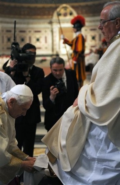 Pope Benedict XVI washes the foot of an unidentified layman in the Basilica of St. John Lateran in Rome, Thursday, April 1, 2010. The feet-washing ceremony symbolizes humility and commemorates Jesus' last supper with his 12 apostles on the evening before his Good Friday crucifixion. (AP Photo/Christophe Simon, Pool)