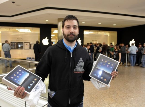 Jason Saucier leaves after being the first customer to buy the iPad at the Apple Store at West Farms Mall in Farmington, Connecticut, on April 3, 2010. Customer's lined up in the mall to purchase Apple's much-anticipated iPad that went on sale at 9 a.m. Saturday in each time zone. AFP PHOTO/TIMOTHY A. CLARY (Photo credit should read TIMOTHY A. CLARY/AFP/Getty Images)