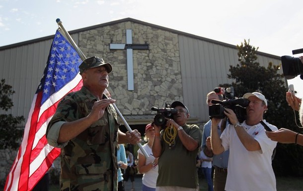 GAINESVILLE, FL - SEPTEMBER 10:  Charlie Paleveda, a former U.S. Marine, speaks with the media in front of the Dove World Outreach Center, to show support for Pastor Terry Jones on September 10, 2010 in Gainesville, Florida. Jones said that he would cancel the planned burning of Korans on Saturday if he was able to meet with the organizers building the Park51 mosque near Ground Zero.  (Photo by Joe Raedle/Getty Images)