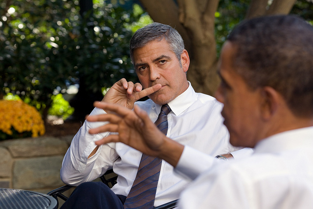 President Barack Obama talks about Sudan with actor George Clooney during a meeting outside the Oval Office, Oct. 12, 2010.  (Official White House Photo by Pete Souza) This official White House photograph is being made available only for publication by news organizations and/or for personal use printing by the subject(s) of the photograph. The photograph may not be manipulated in any way and may not be used in commercial or political materials, advertisements, emails, products, promotions that in any way suggests approval or endorsement of the President, the First Family, or the White House.