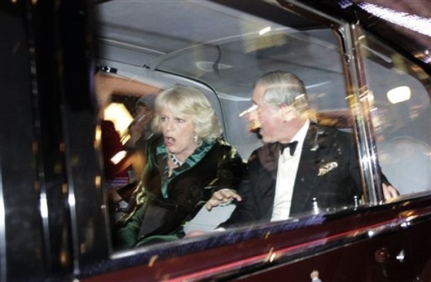 ALTERNATIVE CROP OF LMD120 Britain's Prince Charles and Camilla, Duchess of Cornwall react as their car is attacked, in London, Thursday, Dec. 9, 2010. Angry protesters in London have attacked a car containing Prince Charles, the heir to the British throne, and his wife Camilla, Duchess of Cornwall. An Associated Press photographer saw demonstrators kick the car in Regent Street, in the heart of London's shopping district. The car then sped off. Charles' office, Clarence House, confirmed that "their royal highnesses' car was attacked by protesters on the way to their engagement at the London Palladium this evening, but their royal highnesses are unharmed." (AP Photo/Matt Dunham)