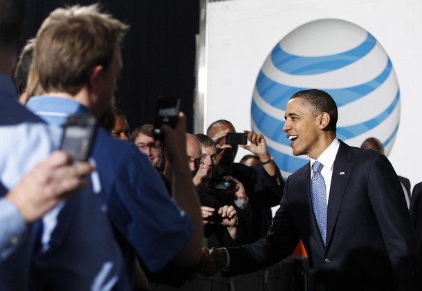 U.S. President Barack Obama greets employees at a UPS shipping facility in Landover, Maryland April 1, 2011. Obama said on Friday he believes U.S. lawmakers are close to a budget deal but warned there is a chance an impasse could lead to a government shutdown. REUTERS/Jim Young (UNITED STATES - Tags: POLITICS BUSINESS)