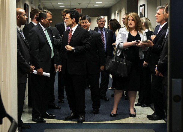 WASHINGTON - JUNE 22:  U.S. Speaker of the House Rep. John Boehner (R-OH) (L) listens to House Majority Leader Rep. Eric Cantor (R-VA) (2nd L) as House Majority Whip Kevin McCarthy (R-CA) (R) looks on prior to a news briefing after a House Republican conference meeting June 22, 2011 at the headquarters of the Republican National Committee on Capitol Hill in Washington, DC. The House GOP leaders discussed various issues, including the spending cut, with the media.  (Photo by Alex Wong/Getty Images)