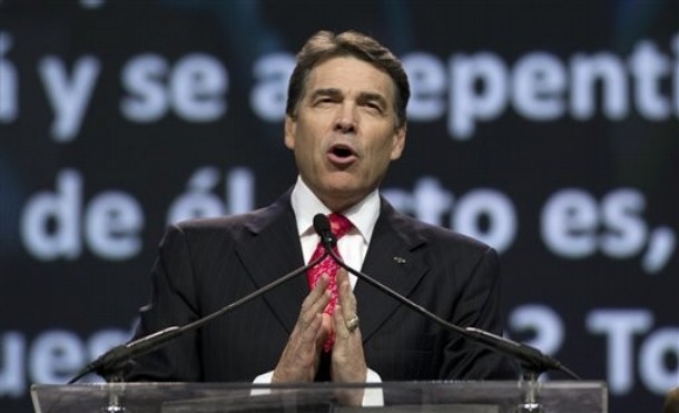 Texas Gov. Rick Perry prays at The Response, a call to prayer for a nation in crisis, Saturday, Aug. 6, 2011, in Houston. Perry attended the daylong prayer rally despite criticism that the event inappropriately mixes religion and politics. (AP Photo/David J. Phillip)