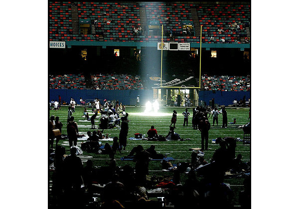 KRT US NEWS STORY SLUGGED: WEA-KATRINA KRT PHOTOGRAPH BY KHAMPHA BOUAPHANH/FORT WORTH STAR-TELEGRAM (DALLAS OUT) (August 31) NEW ORLEANS, LA -- A beam of light streams through the damaged roof in the Superdome in New Orleans, Louisiana, on Wednesday August 31, 2005. (gsb) 2005