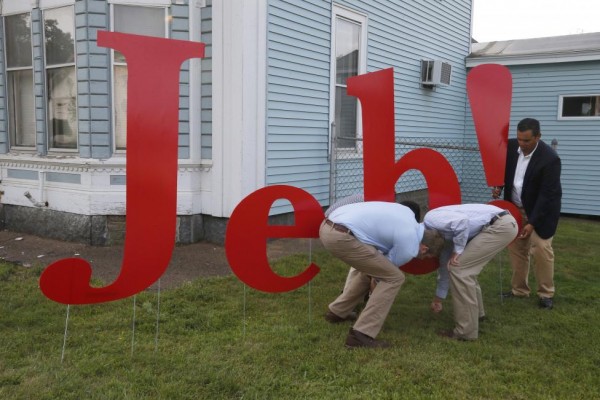 Campaign workers put up letters spelling "Jeb!" outside the site of a campaign town hall meeting with U.S. Republican presidential candidate Jeb Bush at the VFW post in Laconia