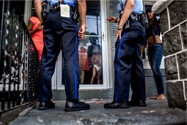 Officers respond to a call regarding a young woman being threatened by an ex boyfriend. After asking a series of questions, the police filed a domestic report. July 29, 2015. Philadelphia, Pa.