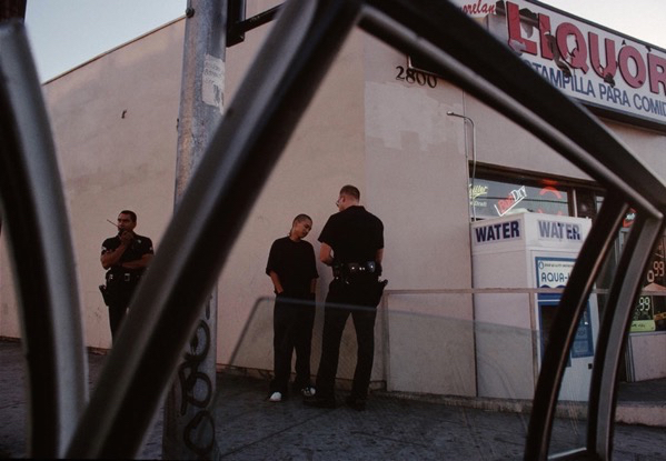 A young man received a ticket for jaywalking. Los Angeles. Joseph Rodriguez.