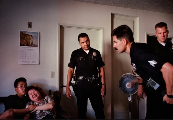 Rampart officers comforted a woman whose husband had just choked to death. Los Angeles. Joseph Rodriguez.