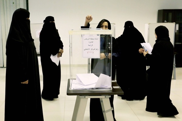 In municipal Saudi elections, women cast their votes at a polling station in Riyadh.