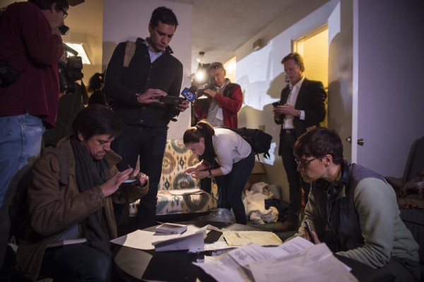 Members of the media take photos and video while looking through documents inside the home. Landlord Doyle Miller told The Washington Post that after the FBI had “released the property” to him, he decided to allow one media organization, which he did not identify, to tour the site, a low-slung, two-story property. Others then “stormed in” he said.