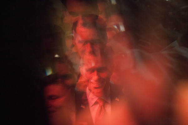 photo: Ron Haviv/VII. caption: U.S. Sen. Scott Walker (R-WI), front runner in New Hampshire polls, reflected in glass, meets people before speaking at the First in the Nation Republican Leadership Summit in Nashua, New Hampshire.