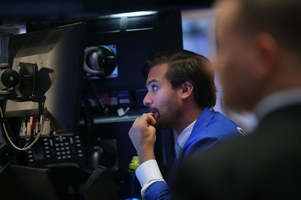 Traders work on the floor of the New York Stock Exchange (NYSE) on January 7, 2016 in New York City. Chinese stocks plunged on Thursday by more than 7 percent causing the Dow to drop over 200 points in morning trading. Spencer Platt/Getty Images.