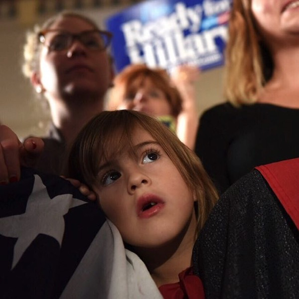 Barbara Kinney. Imagery via Instagram. caption: Youngster watching Hillary yesterday at a rally in Tulsa.
