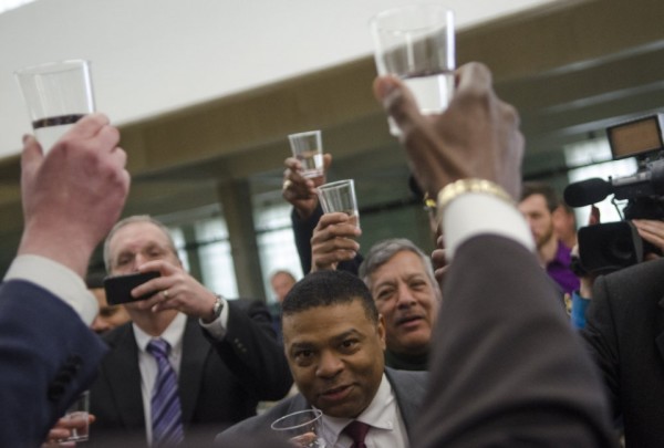 City and state officials toast Flint's switch to Flint River water in April 2014.