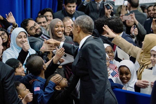 President Obama greeted families in an overflow room after speaking at the Islamic Society of Baltimore mosque.