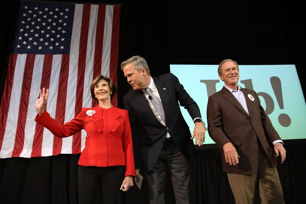Republican presidential candidate Jeb Bush (C) stands with his brother, former President George W. Bush (R) and former First Lady Laura Bush (L) at a campaign rally on February 15, 2016 in North Charleston, South Carolina. The Bush campaign is seeking support in South Carolina, where George W. Bush is popular with the state's large military population, before the Republican primary on Saturday, February 20.