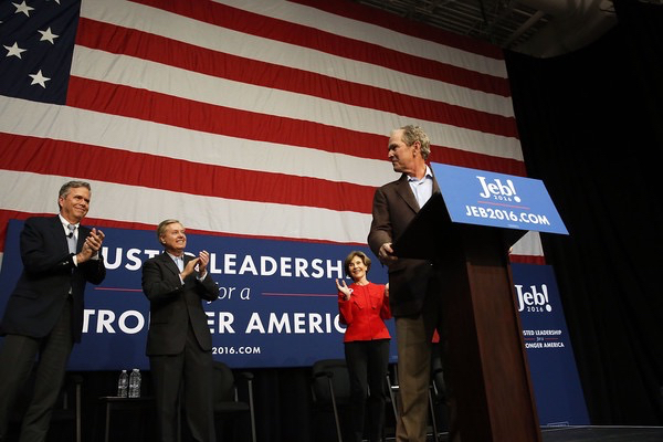 Republican presidential candidate Jeb Bush and his brother, former President George W. Bush and former First Lady Laura Bush at a campaign rally on February 15, 2016 in North Charleston, South Carolina. The Bush campaign is seeking support in South Carolina, where George W. Bush is popular with the state's large military population, before the Republican primary on Saturday, February 20.