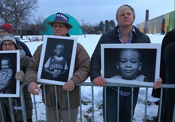 Caption: March 6, 2016. Demonstrators outside the Democratic debate in Flint hold photos of Flint children affected by the Flint water crisis. Photo: Mike Thompson/Detroit Free Press