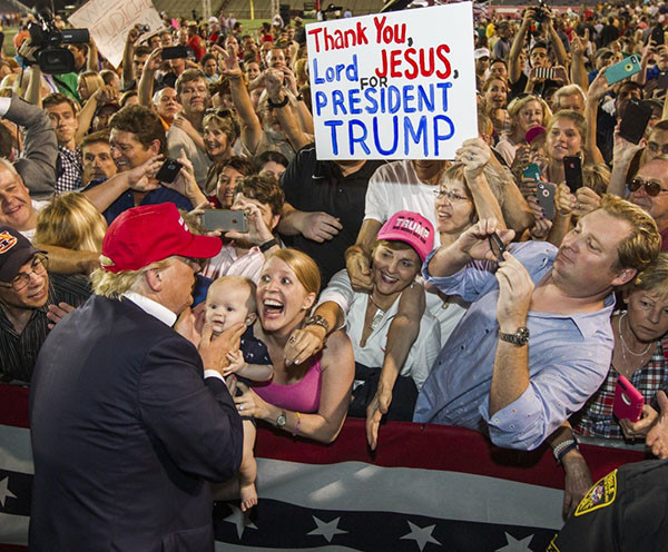 August 21, 2015 . Republican presidential candidate Donald Trump greets supporters after his rally at Ladd-Peebles Stadium in Mobile, Alabama. The Trump campaign moved tonight's rally to a larger stadium to accommodate demand. Photo: Mark Wallheiser/Getty Images